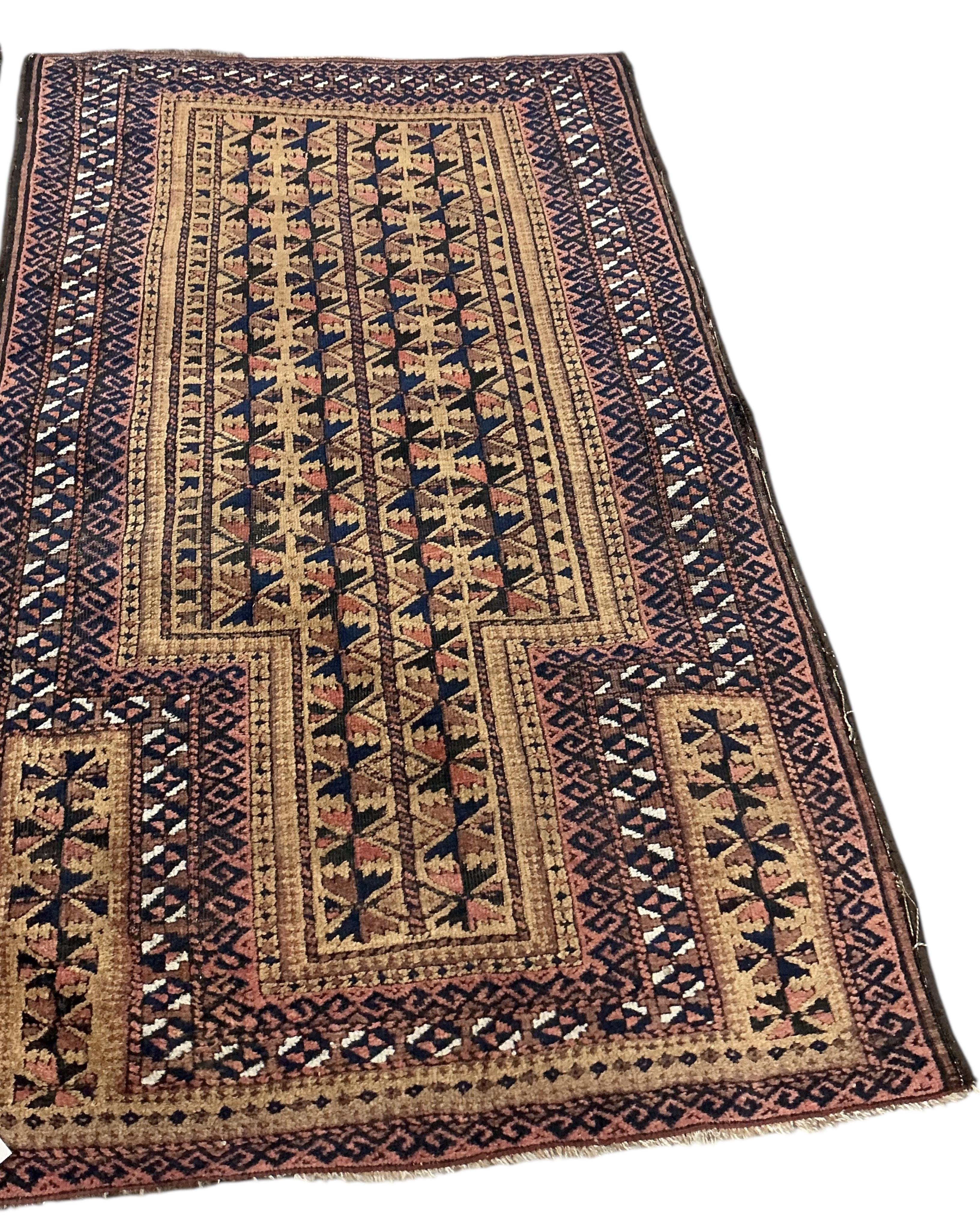 Two Belouch tribal rugs and an Afghan tribal rug, largest 200 x 110cm